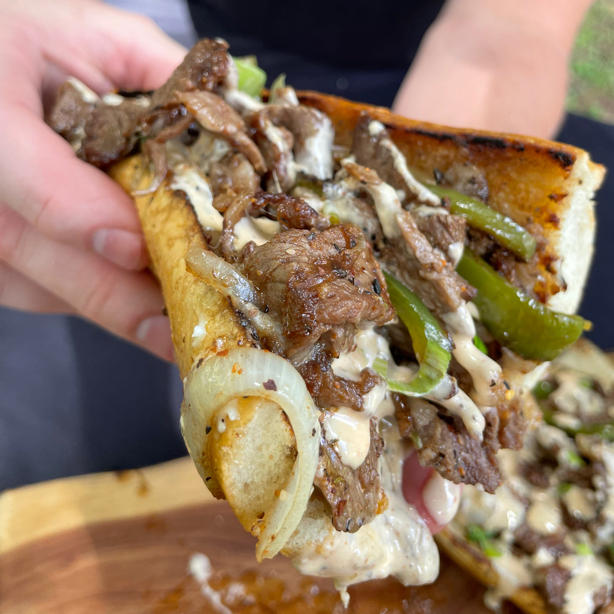 Holding a Backyard Cheesesteak