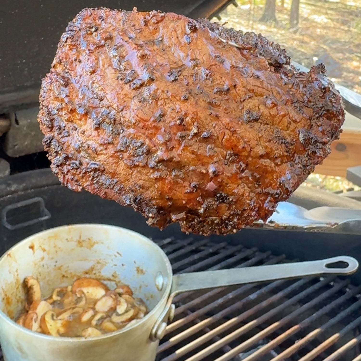 Reverse seared fillet steak with mushroom sauce on the grill