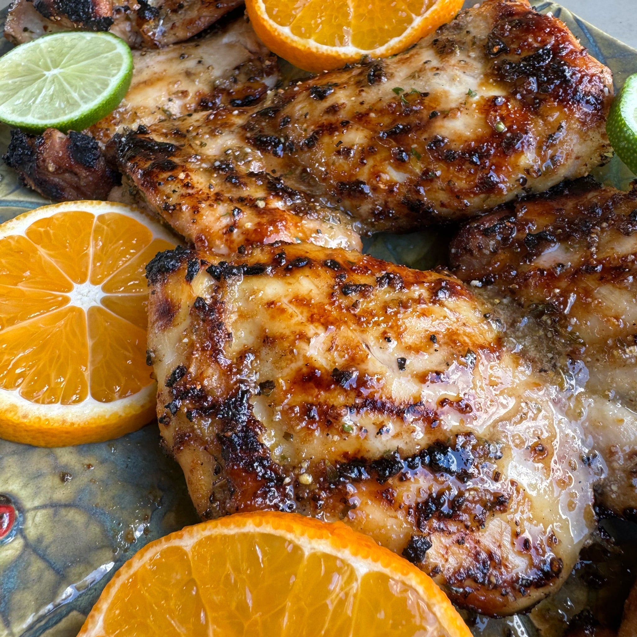 Grilled Tropical Citrus Chicken Thighs with fresh orange and lime