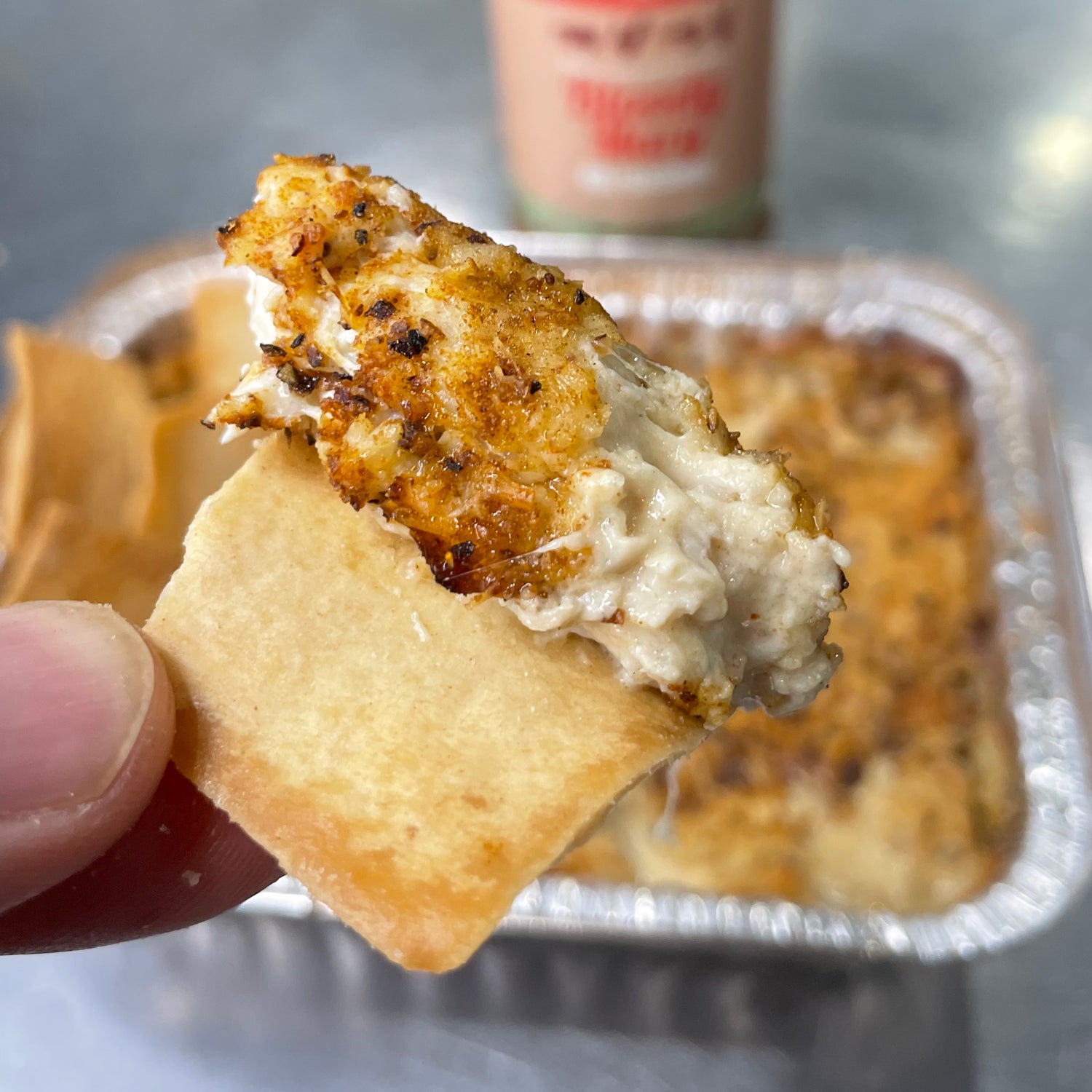 Crab dip on a chip ready to enjoy